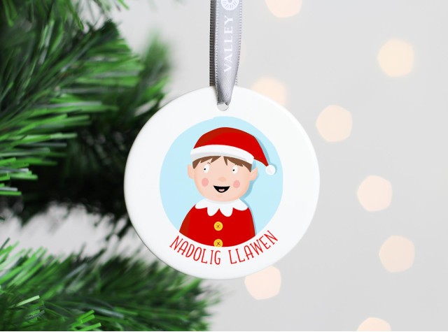 White ceramic christmas tree decoration with the image of a boy elf 2